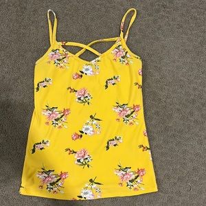 Yellow tank top with crisscross detailing in the front
